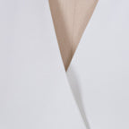 Close-up detail of the white lapel blazer's v-neck and lapel design, showcasing its chic features.