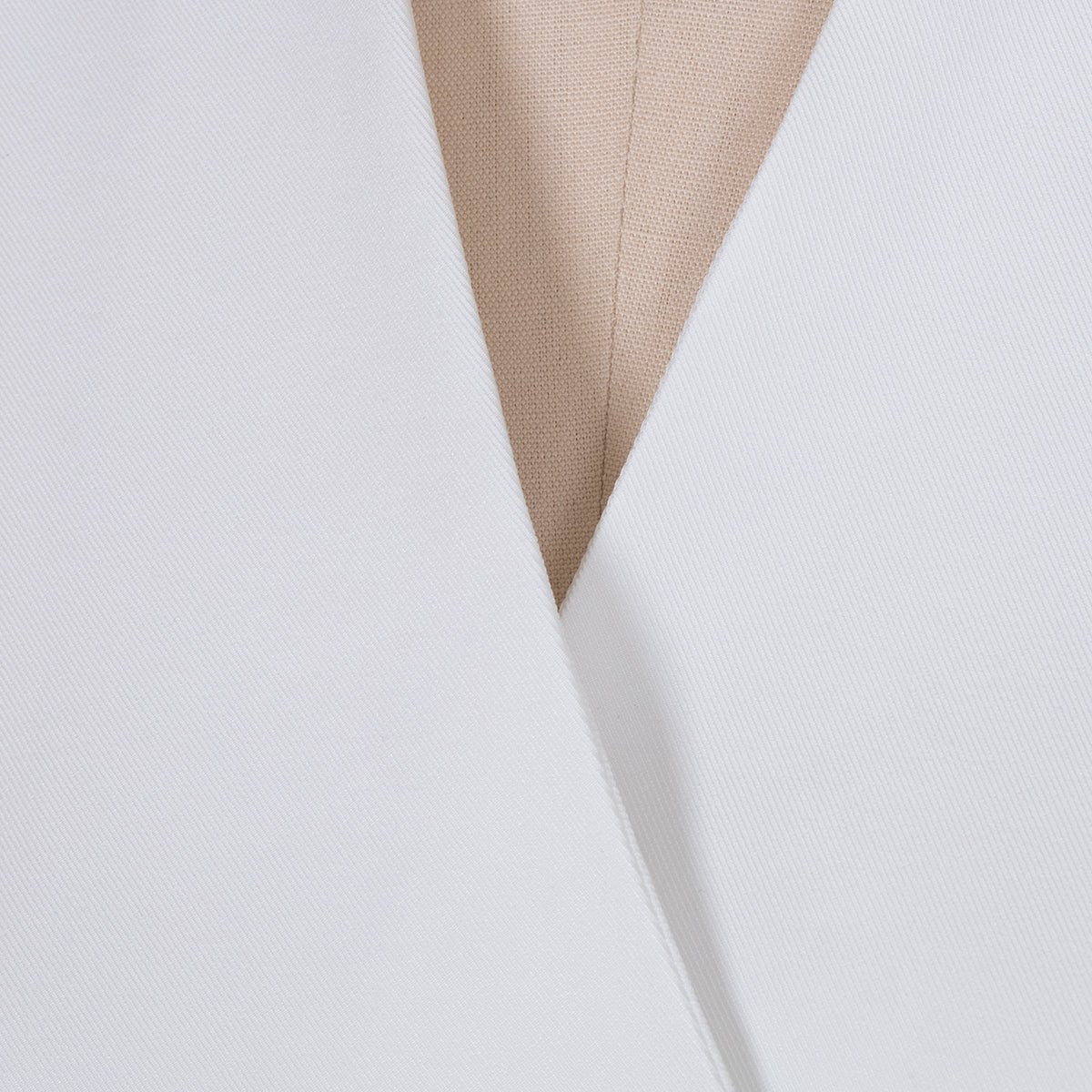 Close-up detail of the white lapel blazer's v-neck and lapel design, showcasing its chic features.