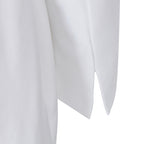 Detail shot of the hem of the white lapel blazer, showcasing its refined finish.