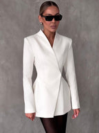 Lifestyle shot of a white lapel blazer with tailored fit, showcasing its chic design against a natural background.