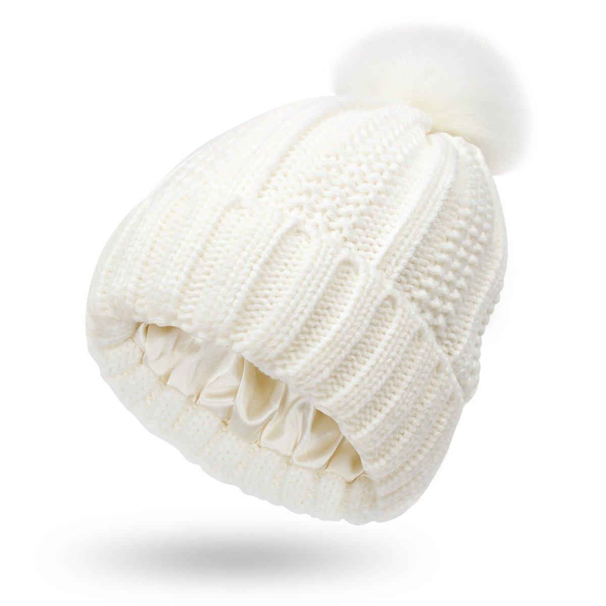Front view of the cream knitted beanie with faux fur pom pom, elegant and cozy for cold weather fashion.