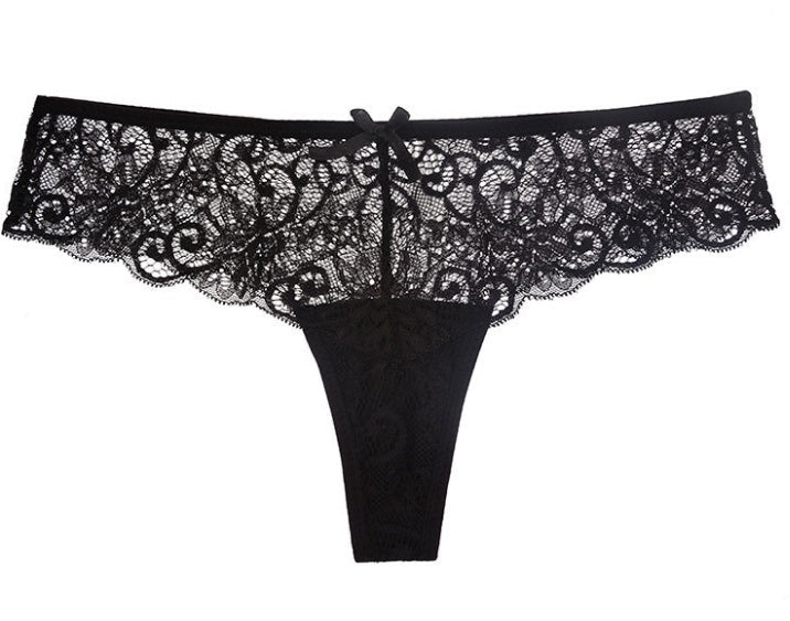 Front view of the black lace thong featuring intricate lace detailing and a bow accent, chic and sensual style.