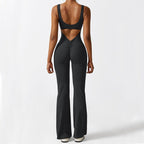 Back view of the black sleeveless flare yoga jumpsuit with an elegant open back design.