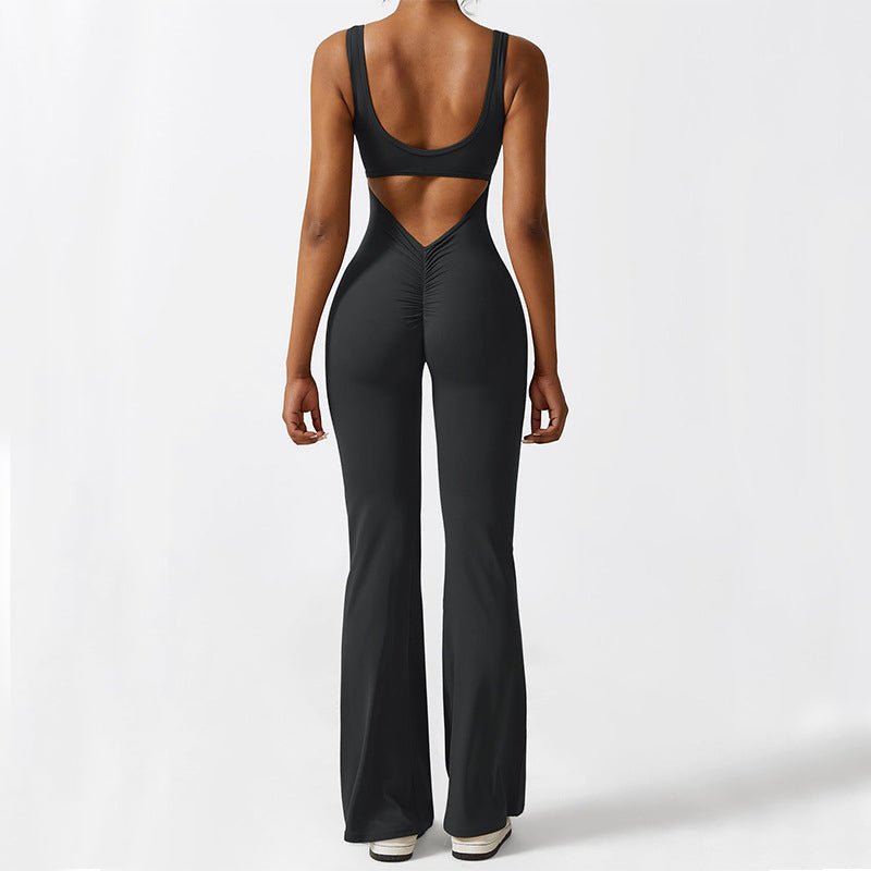 Back view of the black sleeveless flare yoga jumpsuit with an elegant open back design.