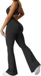 Side view of the black sleeveless flare yoga jumpsuit highlighting the elegant flare legs.