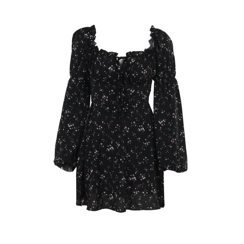 Front view of a black floral dress featuring a floral pattern and long puff sleeves, perfect for stylish occasions.