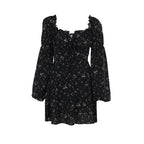 Front view of a black floral dress featuring a floral pattern and long puff sleeves, perfect for stylish occasions.