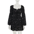 Elegant black floral dress with long puff sleeves in a lifestyle shot, ideal for minimalist fashion lovers.