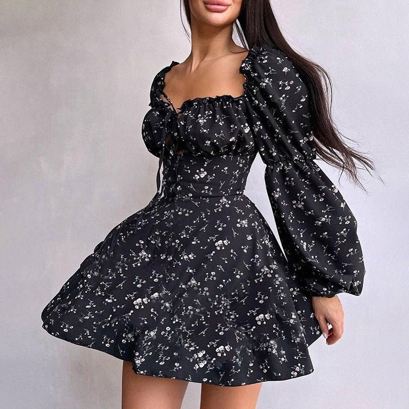 Lifestyle shot of a black floral dress with long puff sleeves, showcasing its elegant and fashionable appeal.