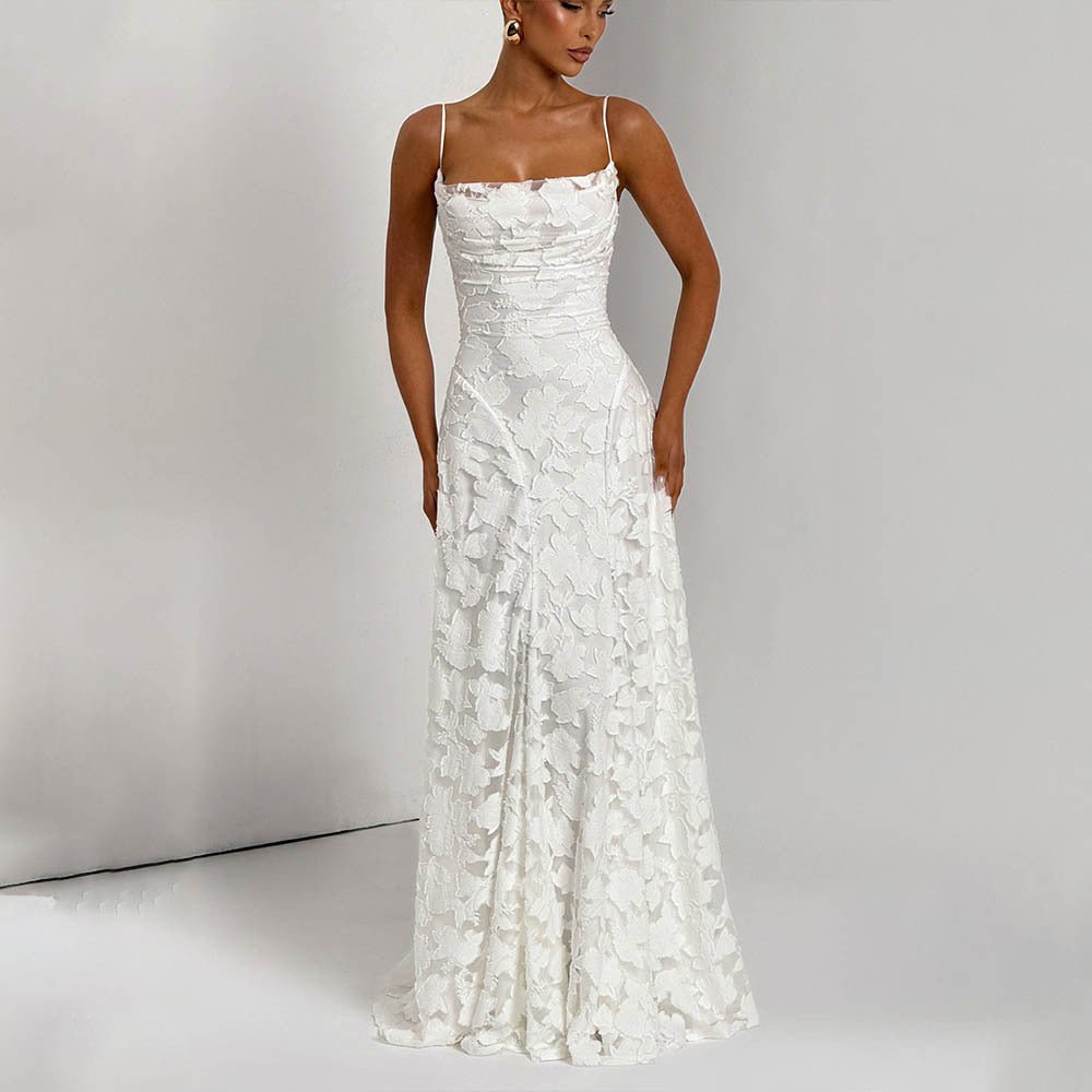 Front view of the white backless chiffon slip dress featuring floral details, styled in a studio setting.