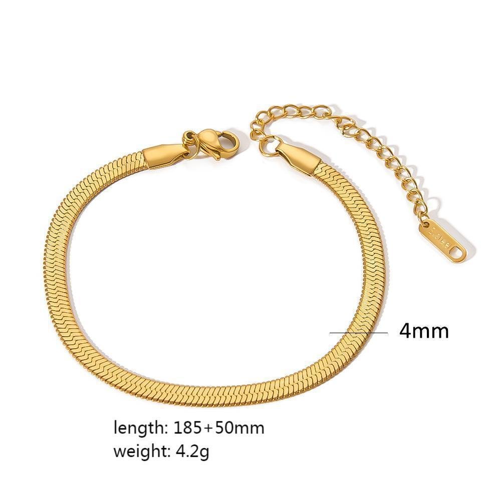 Close-up of a smooth gold minimalist stainless steel bracelet, highlighting its refined finish.