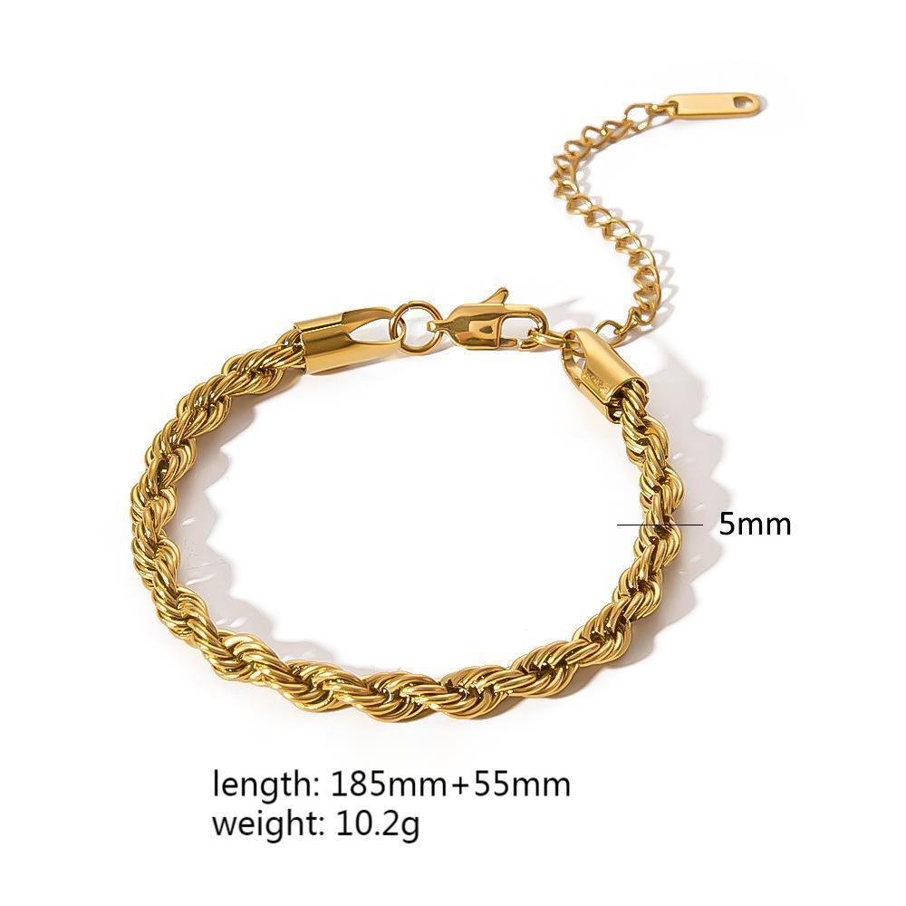 Detail of a twisted gold minimalist stainless steel bracelet, showcasing its sophisticated design.