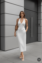 Lifestyle shot of a white halter neck dress highlighting the open back design, sophisticated style @Black#White