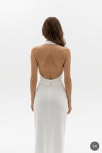 Back view of a white halter neck dress with button detail, elegant minimalist fashion @Black#White