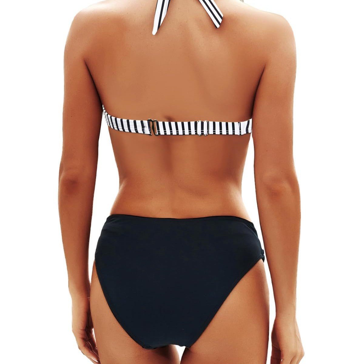 Lifestyle shot of the black bikini set featuring a halter neck and push-up design, perfect for summer.
