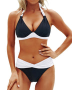 Front view of the black and white color block bikini set with halter neck and push-up features.