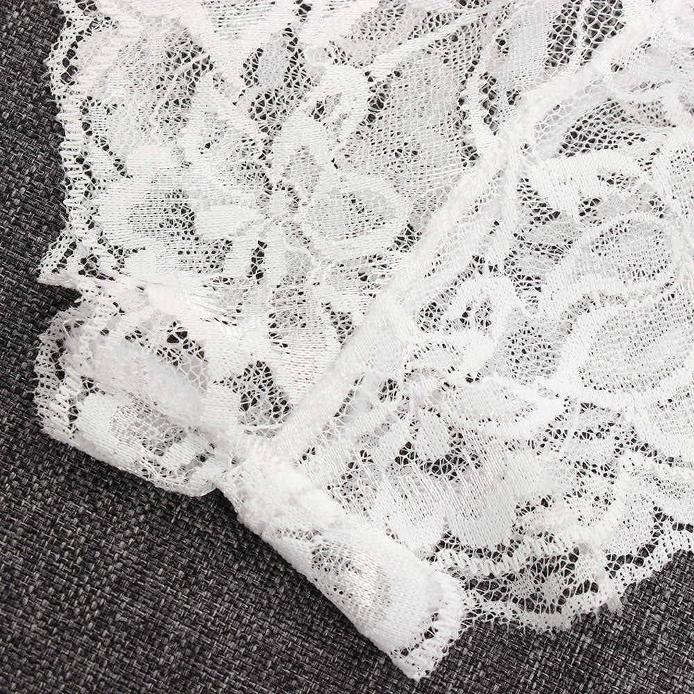 Close-up detail of white lace pattern on high-waist thong, showcasing chic fashion elements