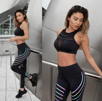 Lifestyle shot of black high-waist leggings, emphasizing the glow design and sporty style.
