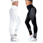 Side view of high-waist leggings in black and white, featuring a glow design for sporty style.