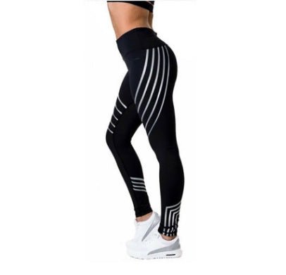 Detail close-up of black high-waist leggings with a striped pattern, highlighting the fabric texture.