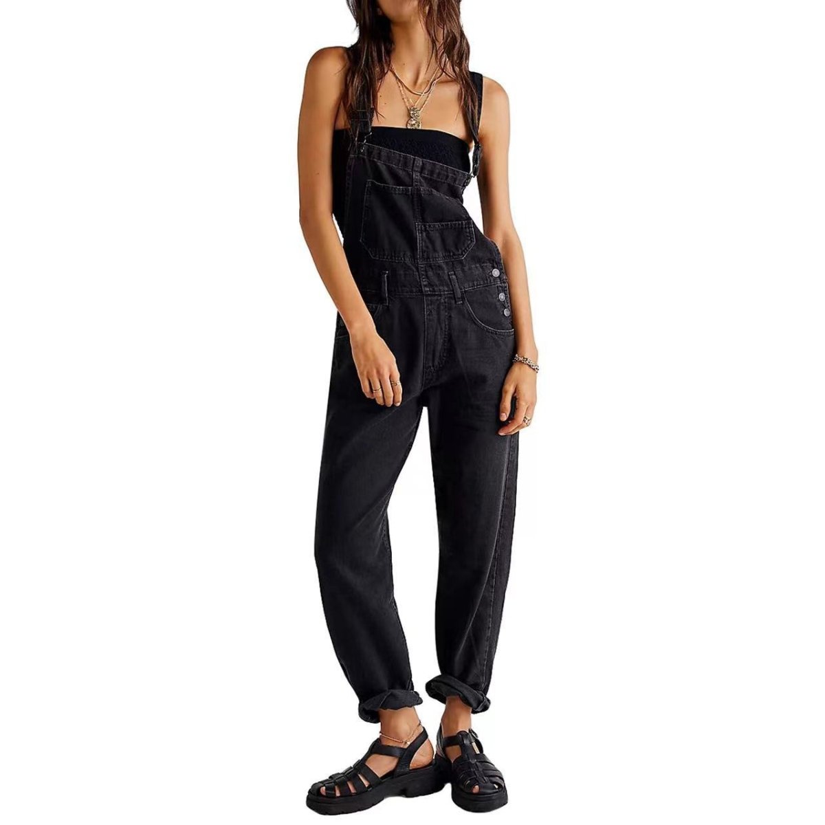 Black high-waisted denim jumpsuit with adjustable straps, side view showcasing a chic casual style.
