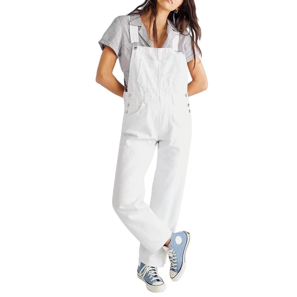 White high-waisted denim jumpsuit showcasing short sleeves and pocket details, side view highlighting chic fashion.