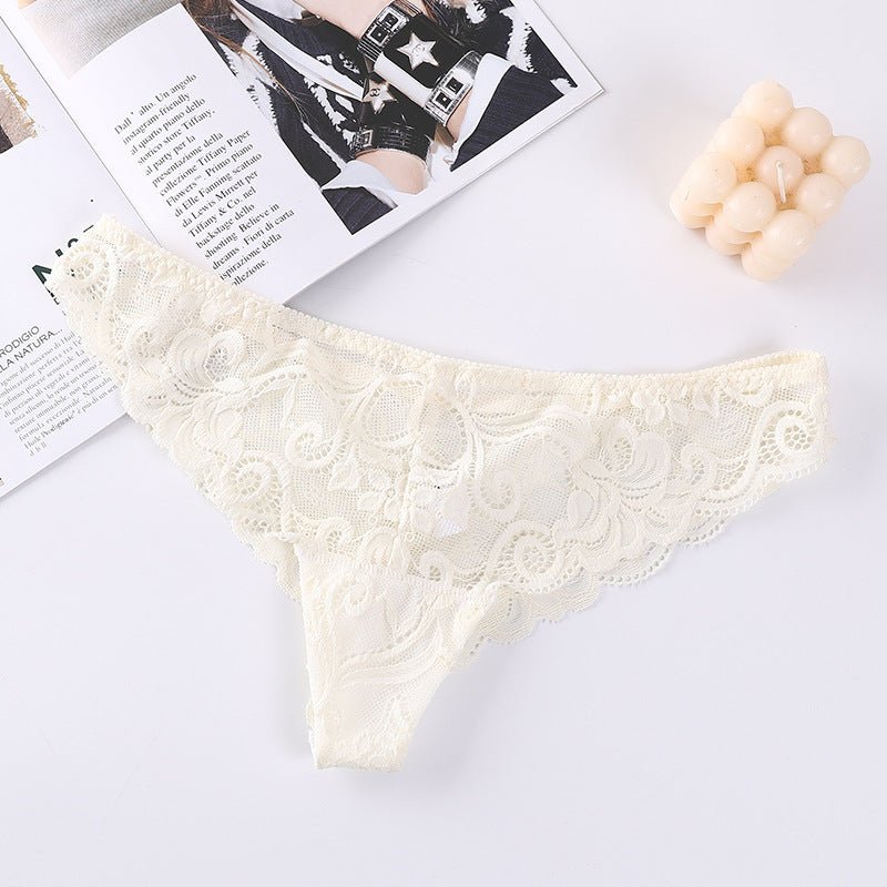 Detail view of cream lace mesh briefs highlighting lace design and ruffled edges.
