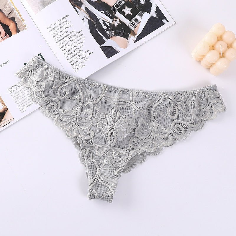 Detail shot of gray lace mesh briefs featuring ruffled edges and intricate lace pattern.