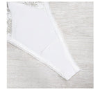 Close-up detail of a white thong showcasing seamless construction and minimalist design.