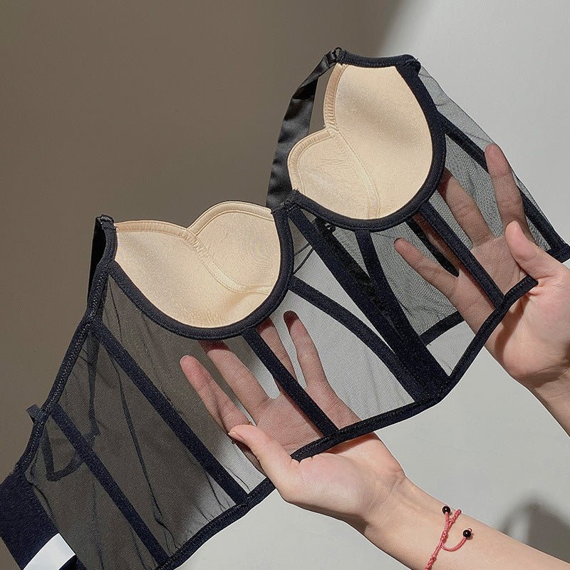Lifestyle view of a black push-up bra featuring mesh fabric and underwire, styled elegantly in a natural setting.