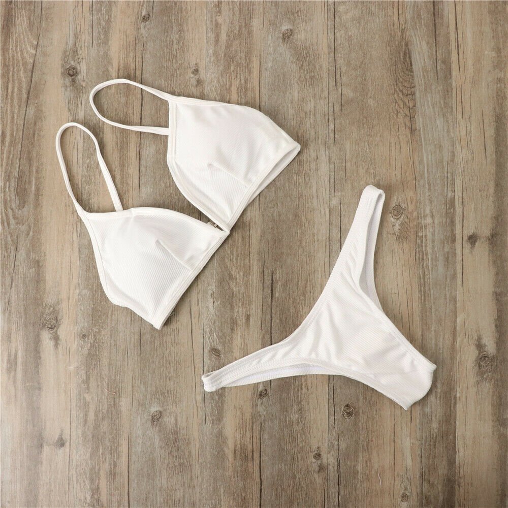 Lifestyle image featuring various colorful bikini sets, showcasing backless designs in black, yellow, and pink @Black#White
