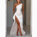 Lifestyle shot of a white satin shoulder slit dress, elegant and minimalist for evening wear