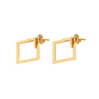 Detail close-up of gold geometric earrings with square shape, highlighting geometric design.