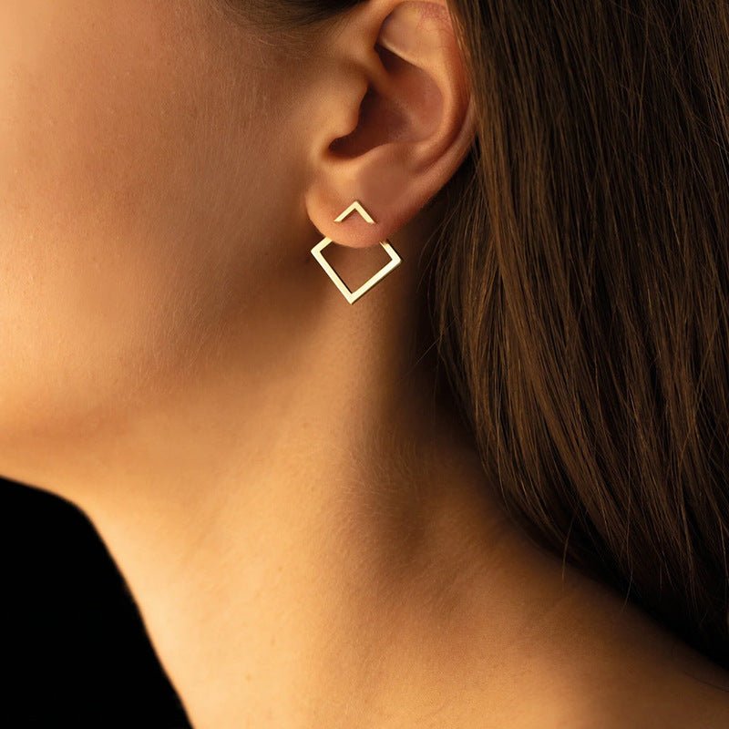 Lifestyle view of geometric titanium steel earrings in gold and silver, highlighting square shape.