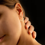 Lifestyle view of geometric titanium steel earrings in silver, featuring a square shape.
