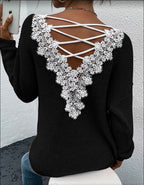 Back view of the black backless sweater featuring a lace-up design and long sleeves.