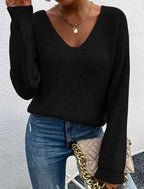 Front view of the black v-neck sweater with long sleeves, showcasing chic minimalist style.
